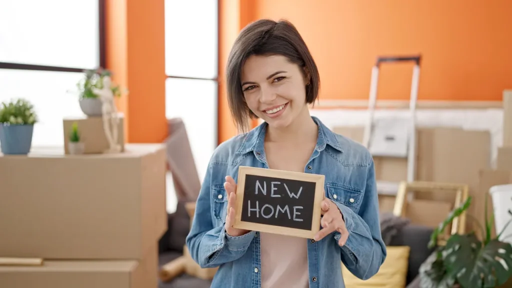 woman new home sign boxes apartment 1280